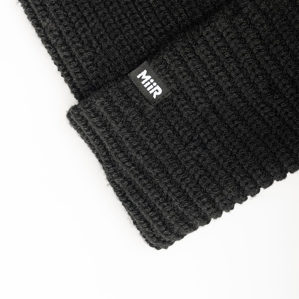 recycled-poly-rib-beanie-x2 WebPDP-RecycledPolyRibBeanie_Studio_TagDetail_Black__BNE002002OS.jpg